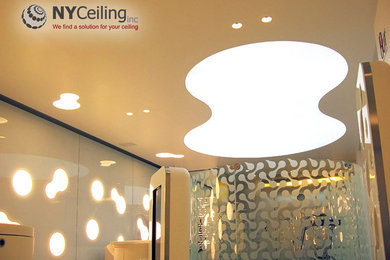 Fabric solid white color stretch ceiling with LED lighting behind it