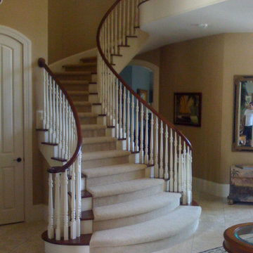 Custom Flared Staircase with Painted and Stained Wooden Parts