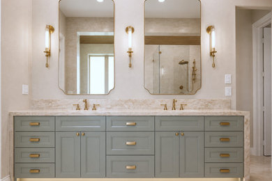 Large transitional master brown tile and ceramic tile porcelain tile, beige floor and double-sink bathroom photo in Houston with recessed-panel cabinets, green cabinets, a bidet, white walls, an undermount sink, quartzite countertops, a hinged shower door, brown countertops, a niche and a built-in vanity