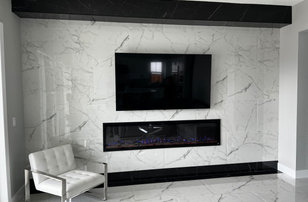 Example of a large trendy open concept porcelain tile and white floor living room design in San Francisco with multicolored walls, a tile fireplace and a wall-mounted tv