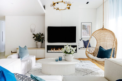 Example of a beach style living room design in Other