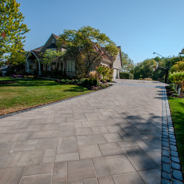 Long Paver Driveway with Cobblestone Edges