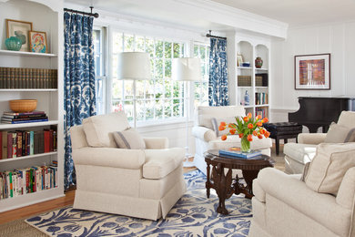 Living room - traditional medium tone wood floor and brown floor living room idea in Richmond with white walls