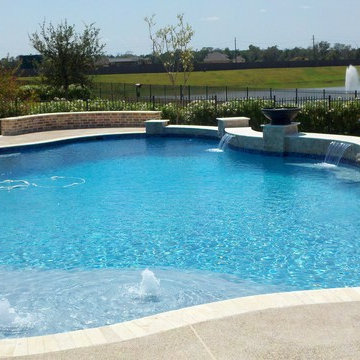 Freeform Travertine Pool with New Orleans Flair