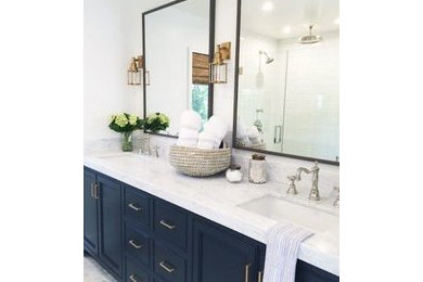 Inspiration for a modern master gray tile and porcelain tile mosaic tile floor tub/shower combo remodel in Chicago with recessed-panel cabinets, black cabinets, a two-piece toilet, white walls, a drop-in sink and soapstone countertops