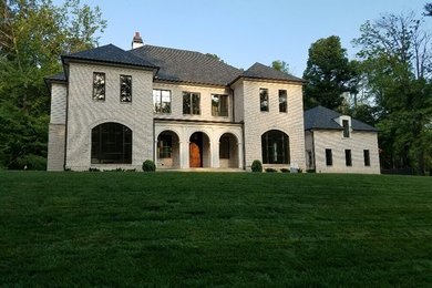 Example of a large transitional home design design in Atlanta