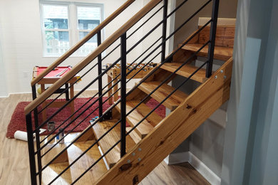 Ejemplo de escalera actual con barandilla de madera