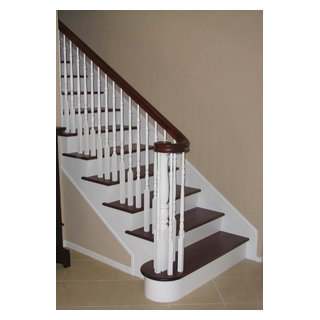 Timeless Traditional Staircase with Wooden Newel Posts and Balusters