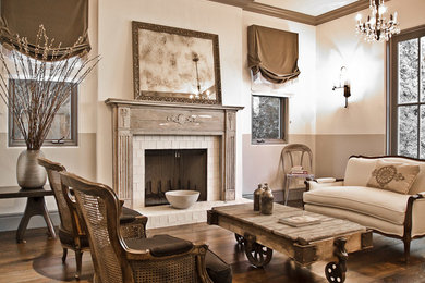 Example of a large mountain style formal and open concept medium tone wood floor and brown floor living room design in Los Angeles with no tv, a standard fireplace and a tile fireplace