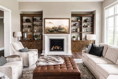 Example of a mid-sized open concept medium tone wood floor, brown floor and wallpaper living room design in Chicago with beige walls, a standard fireplace, a stone fireplace and a wall-mounted tv