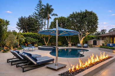 Example of a large tuscan backyard stone pool design in San Diego
