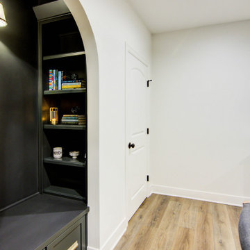 Warm & Inviting Basement Retreat with Kitchenette and Reading Nook