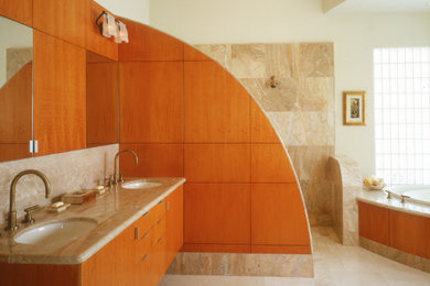 Example of a huge trendy master beige tile and marble tile limestone floor, beige floor and double-sink bathroom design in San Diego with flat-panel cabinets, medium tone wood cabinets, a hot tub, white walls, an undermount sink, marble countertops, beige countertops and a floating vanity