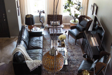 Example of a large minimalist medium tone wood floor living room design in Austin with gray walls