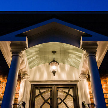 Beautiful evening portico with gable roof and arch facade
