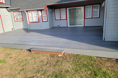 Mid-sized minimalist backyard deck photo in Seattle