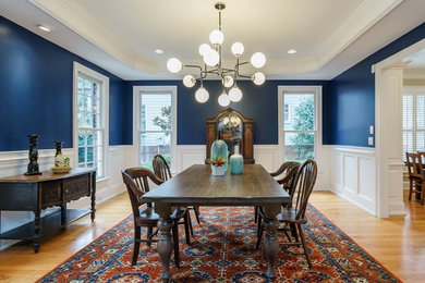 This is an example of a mid-sized eclectic dining room in Raleigh.