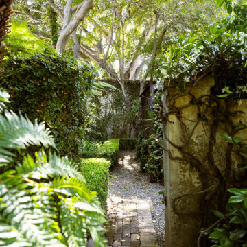 Wall separating public and private gardens
