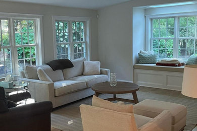 Living room - contemporary open concept light wood floor living room idea in New York with gray walls