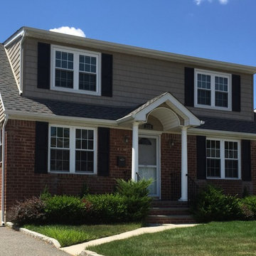 Williston Park Siding - Tuscan Clay Shakes with new Windows & Williamsburg Roof