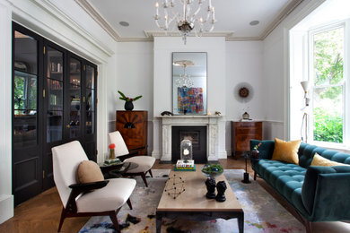 Inspiration for a large classic living room in Dublin with light hardwood flooring and a stone fireplace surround.
