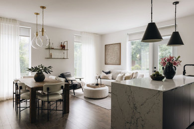 Mid-sized transitional eat-in kitchen photo in Montreal with flat-panel cabinets, dark wood cabinets and an island