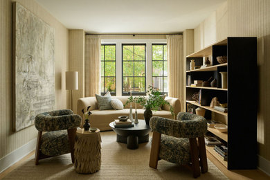 Inspiration for a transitional light wood floor, beige floor and wallpaper living room remodel in Chicago with beige walls and no fireplace