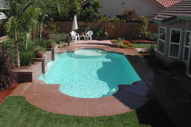 Inspiration for a custom-shaped pool in Sacramento with concrete slab.