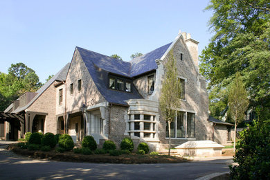 Large elegant beige two-story mixed siding exterior home photo in Charlotte with a shingle roof