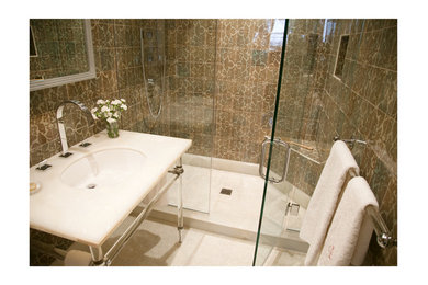 Photo of a transitional master bathroom in New York with onyx benchtops, ceramic tile and mosaic tile floors.