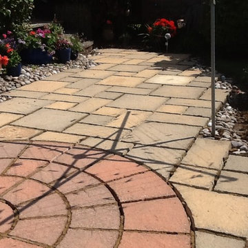 Stained and Damaged Sandstone Patio Restoration in Rushden