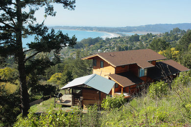 Large coastal brown two-story wood exterior home idea in San Francisco with a shingle roof