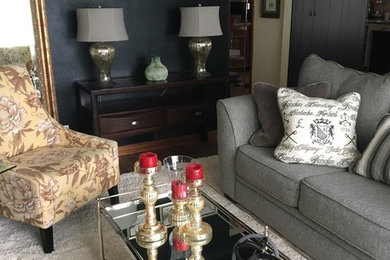 Inspiration for a mid-sized eclectic open concept medium tone wood floor and brown floor family room remodel in Dallas with black walls, no fireplace and no tv