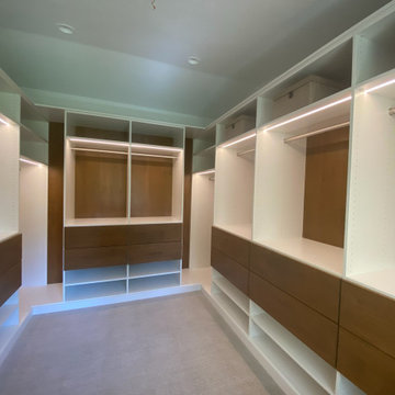Modern Master Closet with Lighting and Drawers