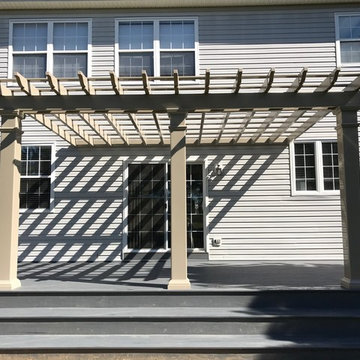 Backyard Deck With Corner-Wrapped Steps and Pergola