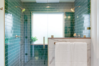 Example of a mid-sized 1950s master green tile and mosaic tile marble floor, white floor and double-sink alcove shower design in Dallas with furniture-like cabinets, medium tone wood cabinets, a one-piece toilet, green walls, an undermount sink, marble countertops, a hinged shower door, white countertops, a niche and a freestanding vanity