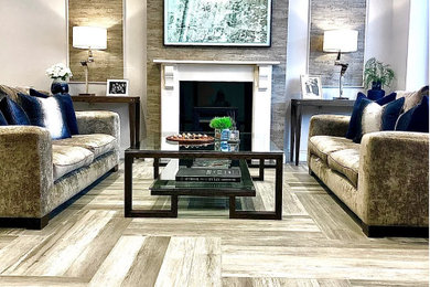 Example of a mid-sized trendy living room design in Hertfordshire with a wood fireplace surround