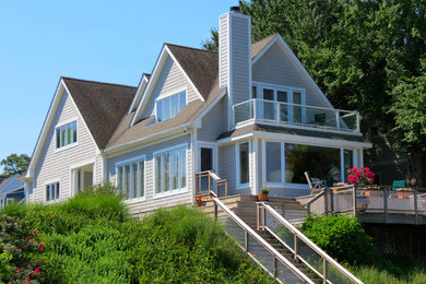 Mid-sized contemporary gray two-story wood gable roof idea in Baltimore