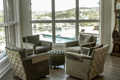 Example of a mid-sized trendy enclosed and formal medium tone wood floor living room design in Austin with beige walls and no fireplace