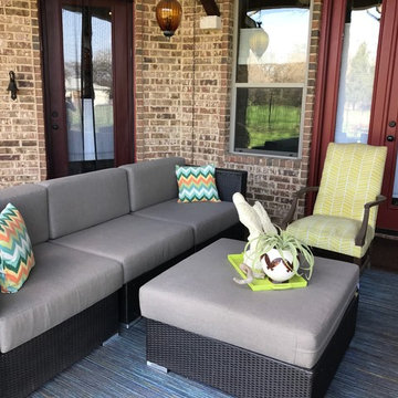 Patio space grounded with neutral Sunbrella Sailcloth Shadow cushions