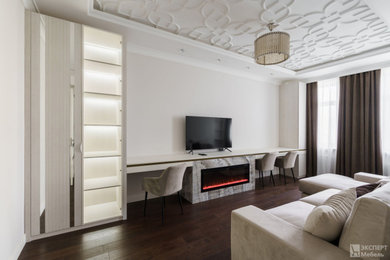 На фото: гостиная комната среднего размера, в белых тонах с отделкой деревом в современном стиле с белыми стенами, отдельно стоящим телевизором и зоной отдыха