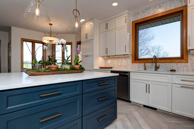 Eat-in kitchen - mid-sized modern u-shaped gray floor and porcelain tile eat-in kitchen idea in Other with an undermount sink, shaker cabinets, white cabinets, quartz countertops, multicolored backsplash, stainless steel appliances, an island, white countertops and ceramic backsplash