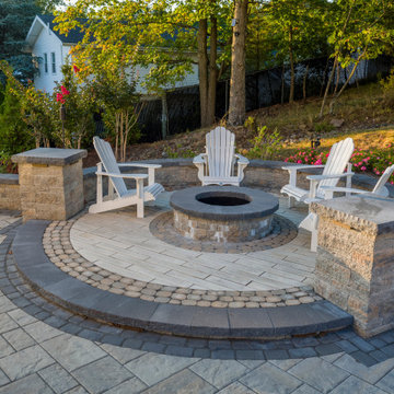 Dual patio with adjoining firepit feature
