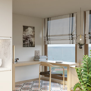 Inspiration for a small modern home studio in Brussels with beige walls, ceramic flooring, no fireplace, a built-in desk and multi-coloured floors.