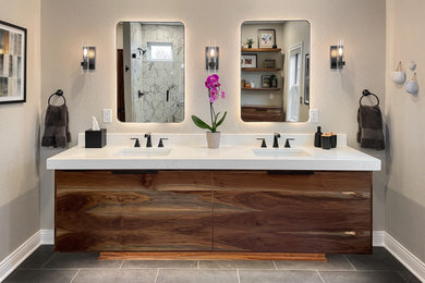 Example of a mid-sized minimalist master beige tile and ceramic tile porcelain tile, black floor and double-sink doorless shower design in Milwaukee with flat-panel cabinets, medium tone wood cabinets, an undermount sink, quartz countertops, white countertops, a niche and a floating vanity