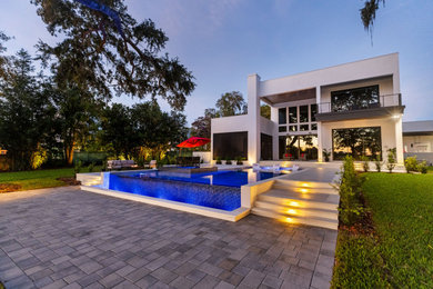 Example of a trendy home design design in Tampa