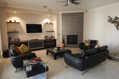 Family room - mid-sized contemporary open concept porcelain tile and brown floor family room idea in Houston with beige walls, a wall-mounted tv and no fireplace
