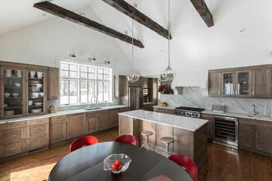 Inspiration for a large rustic l-shaped dark wood floor and brown floor eat-in kitchen remodel in New York with an undermount sink, marble countertops, stone slab backsplash, stainless steel appliances, an island, shaker cabinets, dark wood cabinets and gray backsplash
