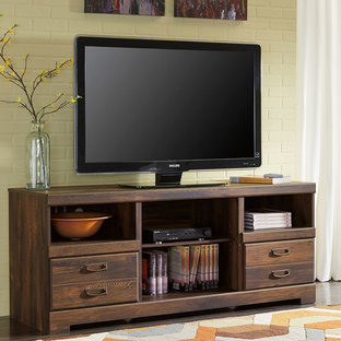 Home theater - medium tone wood floor home theater idea in Newark with yellow walls and a media wall