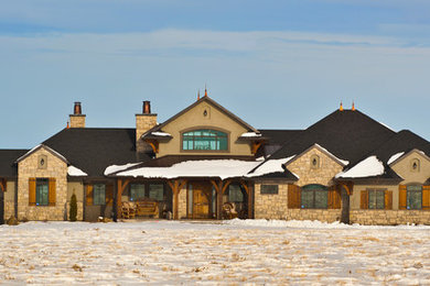 Inspiration for a rustic gray stone exterior home remodel in Other